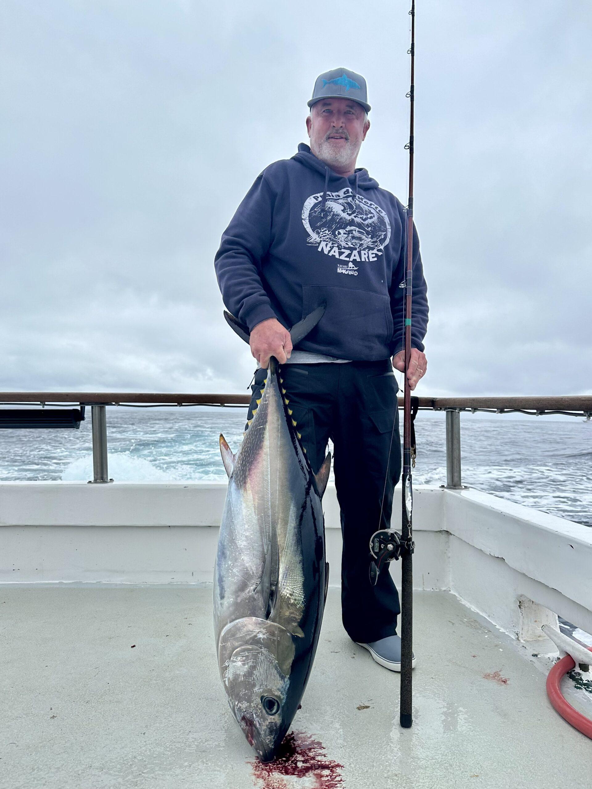Angler with a bluefin. Day fishing,