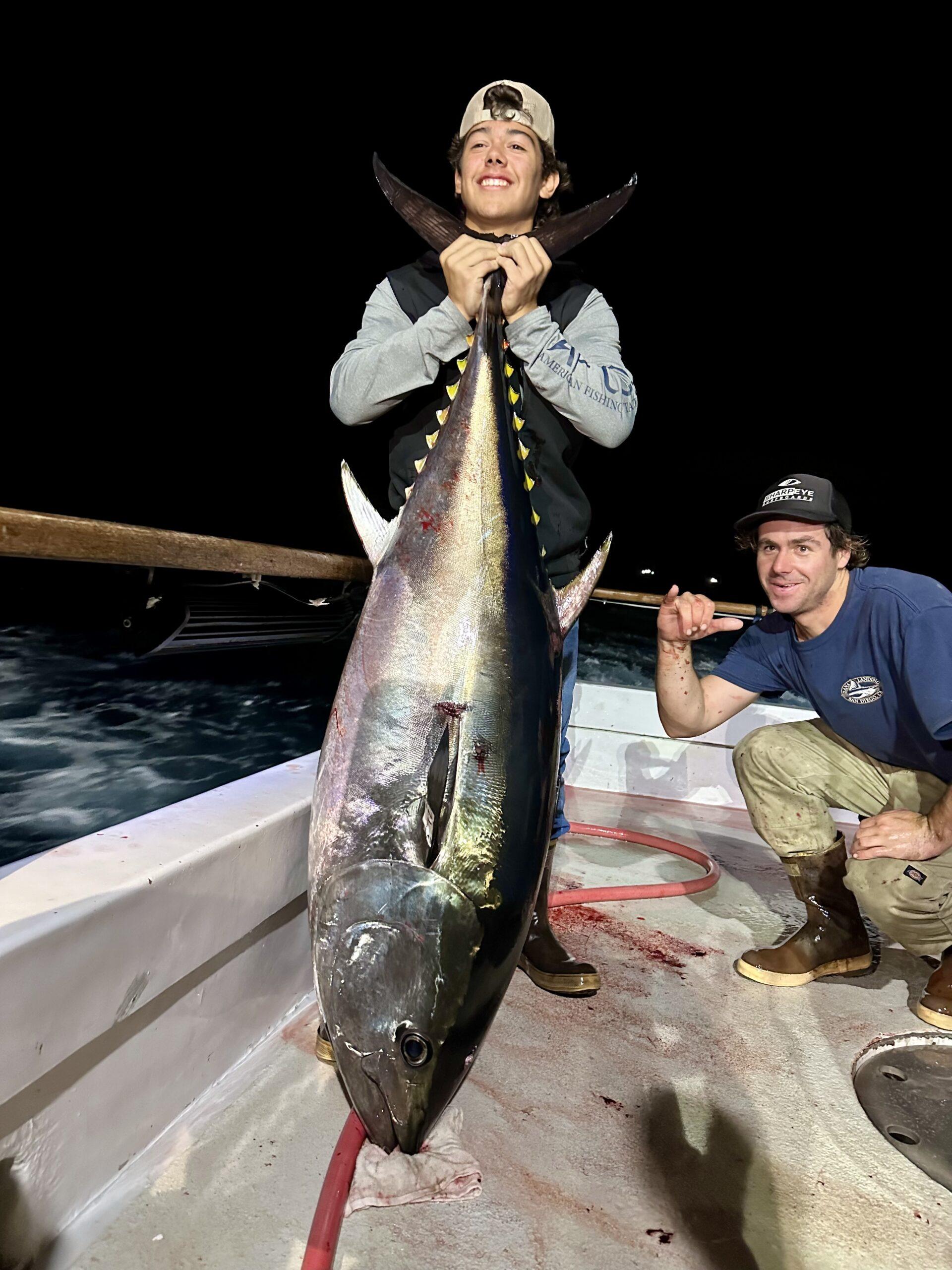 Captain Shane with an angler and large bluefin tuna.