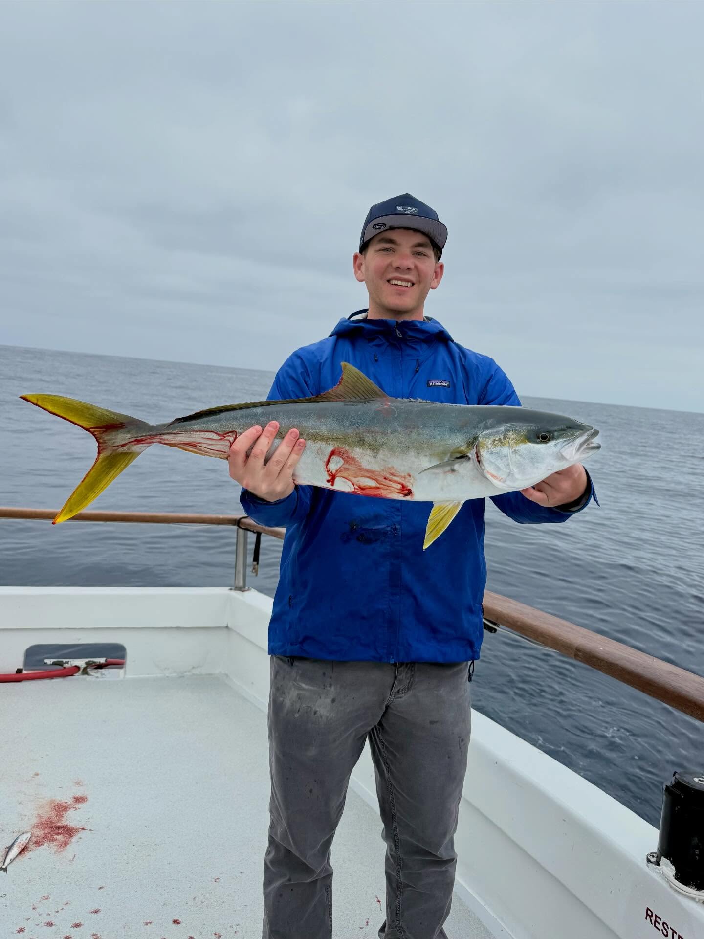 Angler with Yellowtail Fish