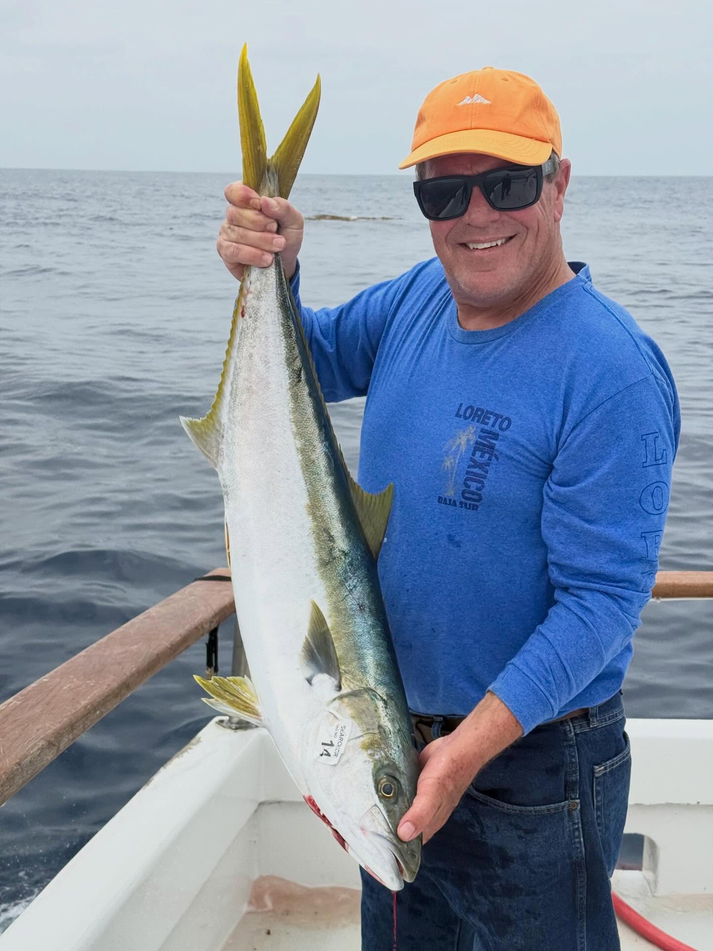 Angler with Yellowtail Fish