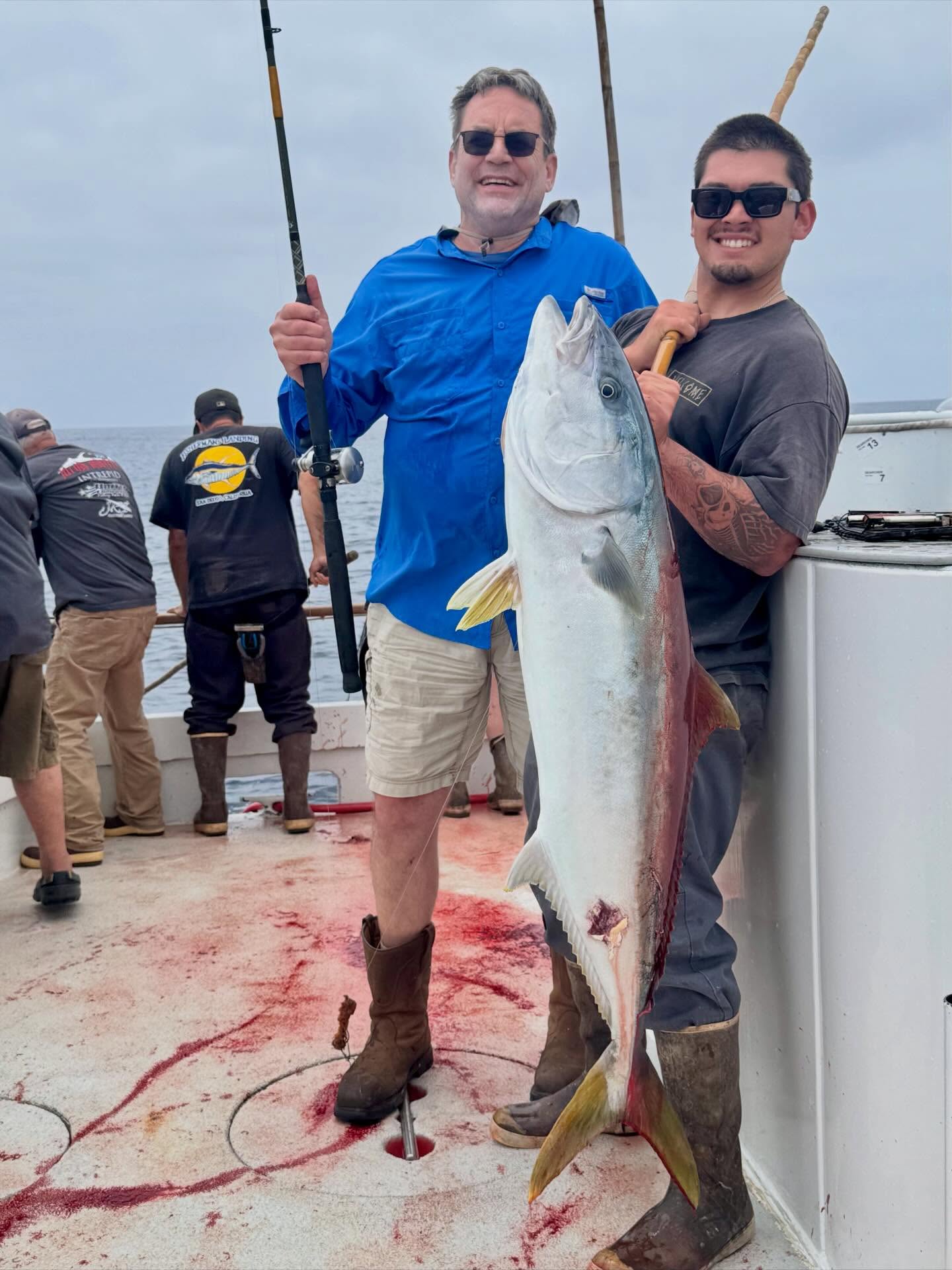Angler with Yellowtail Fish